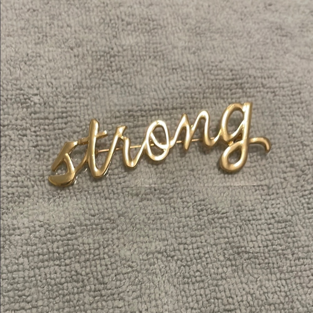 Gold 'Strong' pin